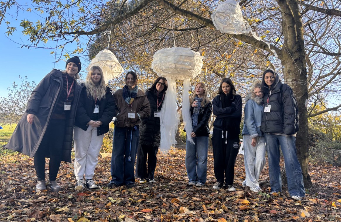 Chichester College students pose with some of the lanterns they created for aprimary school event