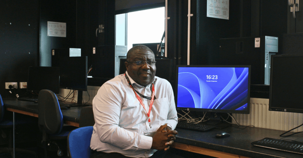 A picture of Greg at a computer desk