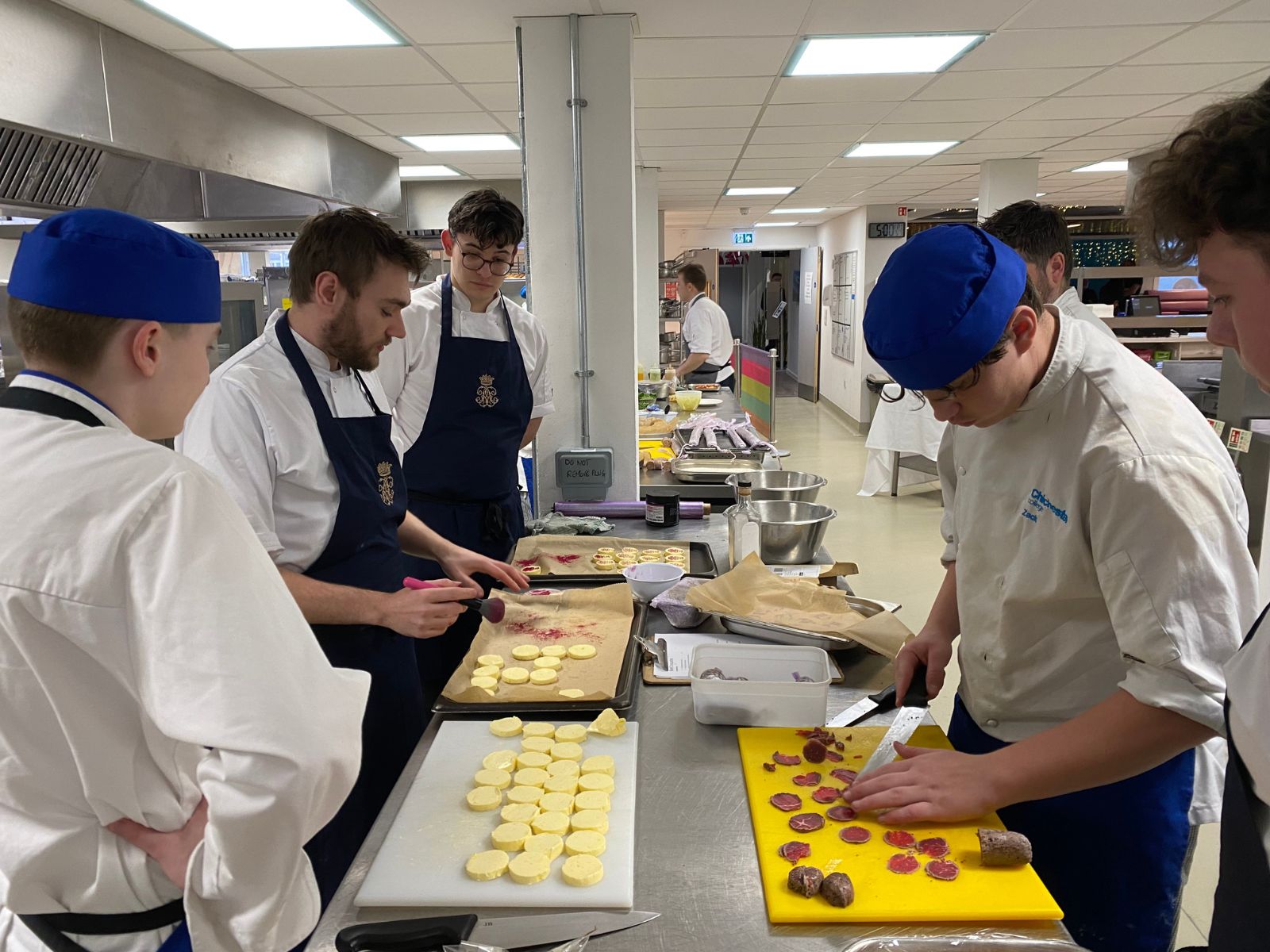 Some of our students working with the Hall & Woodhouse chefs in Restaurant 64.