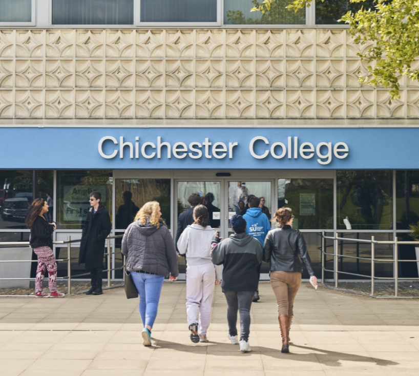 Students walking into Chichester College at the front entrance