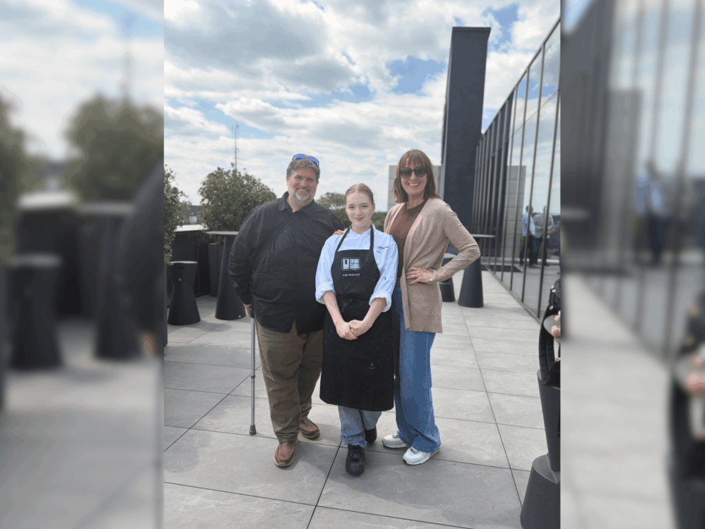 Emily stood outside the competition with members of staff Paul Downing and Sophie Kit